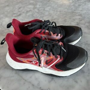 New Balance Boys Rave Run Running Shoe, in red and black, Size 5.5